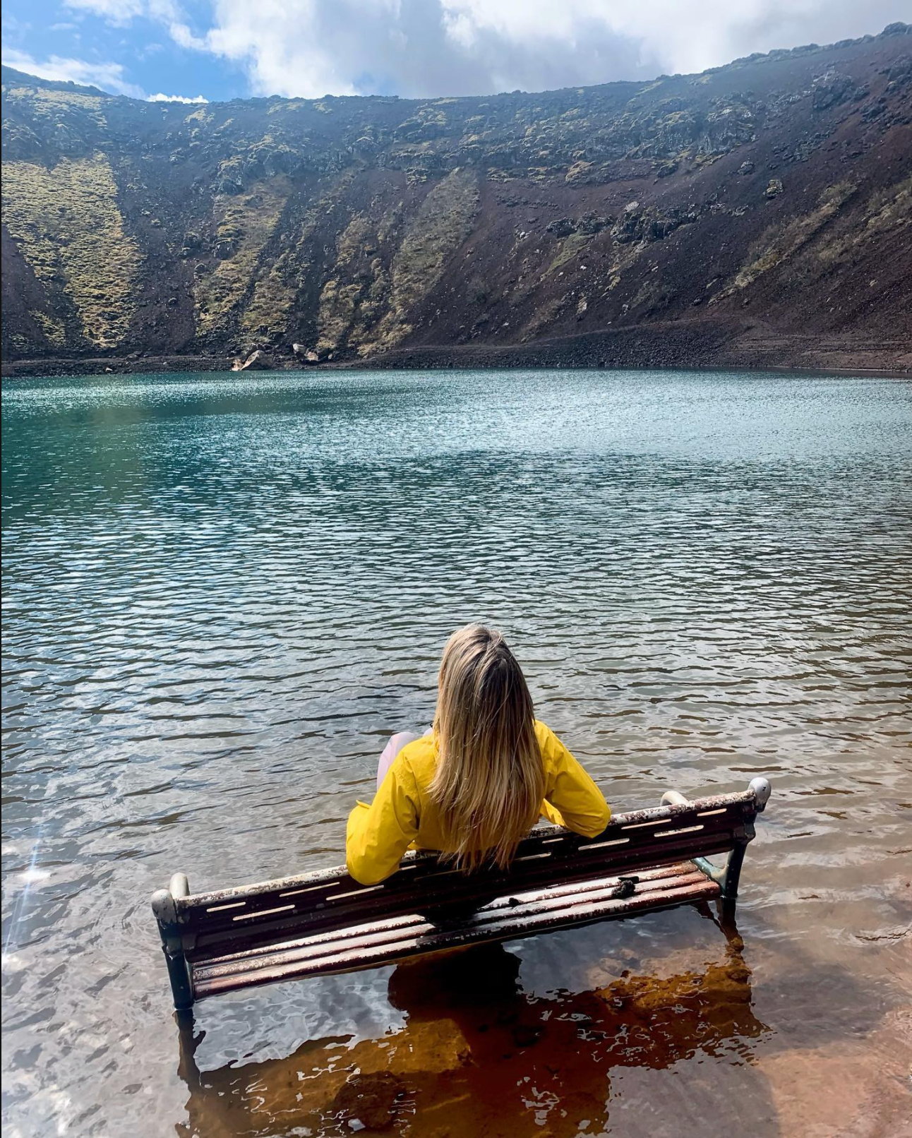 A person meditating in Kerið crater in Iceland's Golden Circle