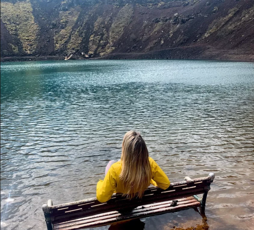 A person meditating in Kerið crater in Iceland's Golden Circle